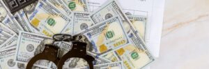 handcuffs on top of money